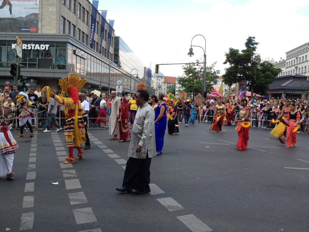 Ambassador Sarrath Kongahage walking along in the Parade